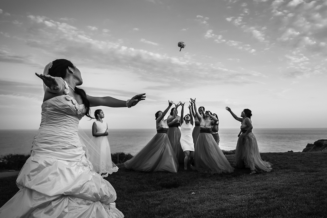 A bride throws her bouquet